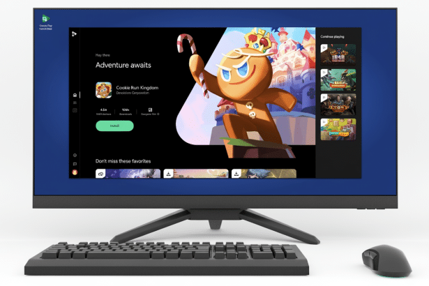A desktop computer screen displaying the Google Play Games Beta app, showing the game Cookie Run: Kingdom as a featured title . The screen is framed by a blue border . A keyboard and mouse are in front of the monitor .