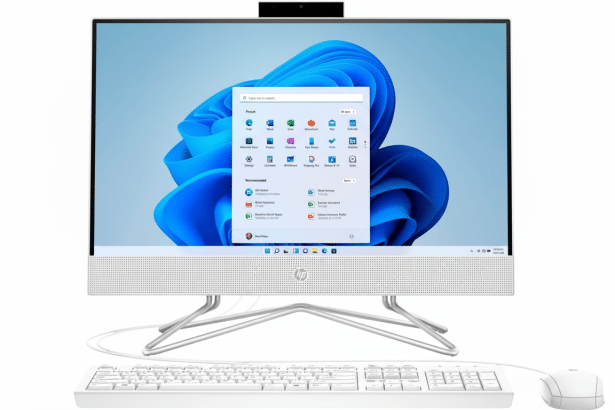 A white HP all -in-one desktop computer with a keyboard and mouse, displaying the Windows 11 operating system on its screen.
