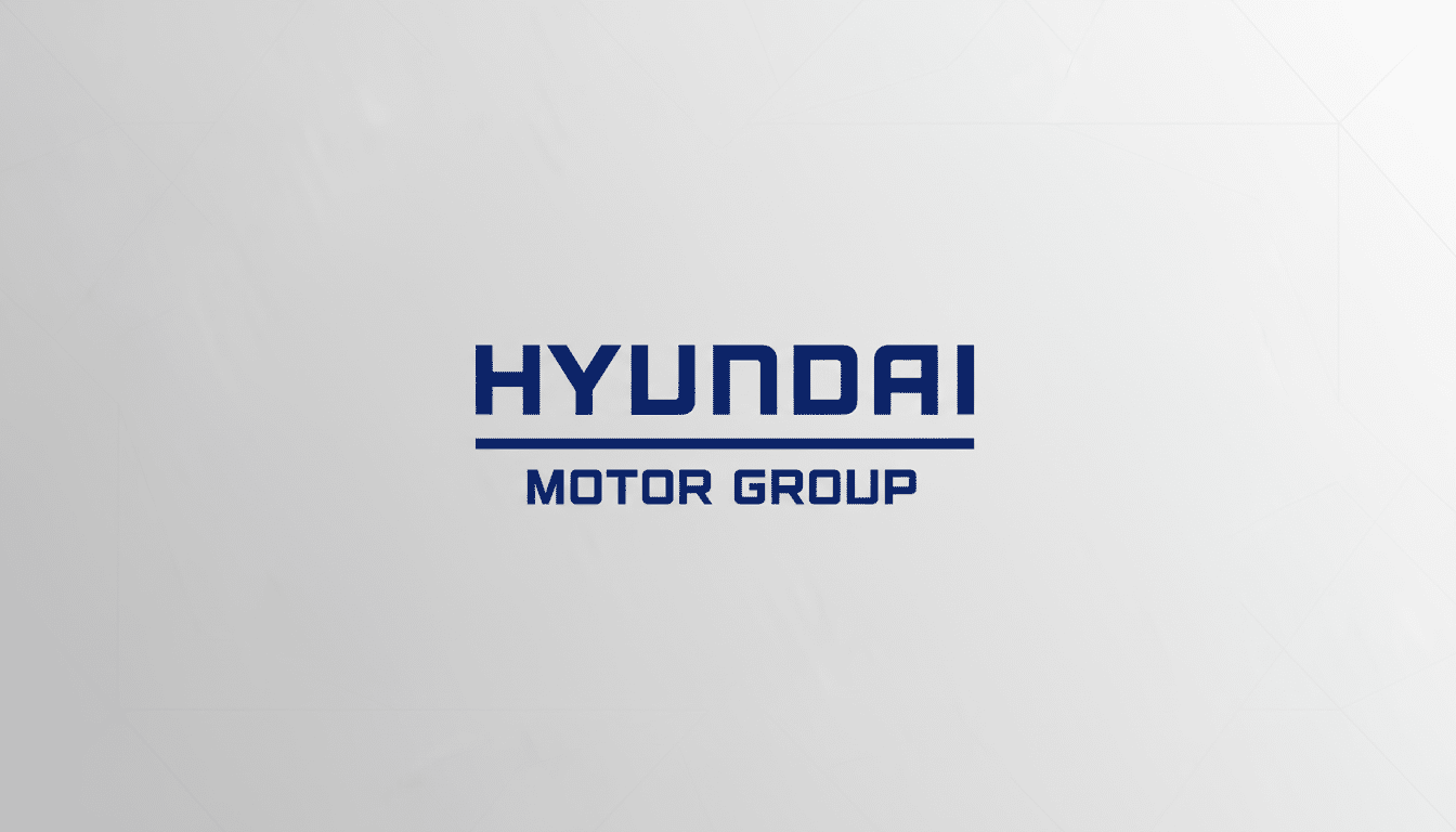 Hyundai Motor Group logo in dark blue text on a light gray background with subtle geometric patterns.