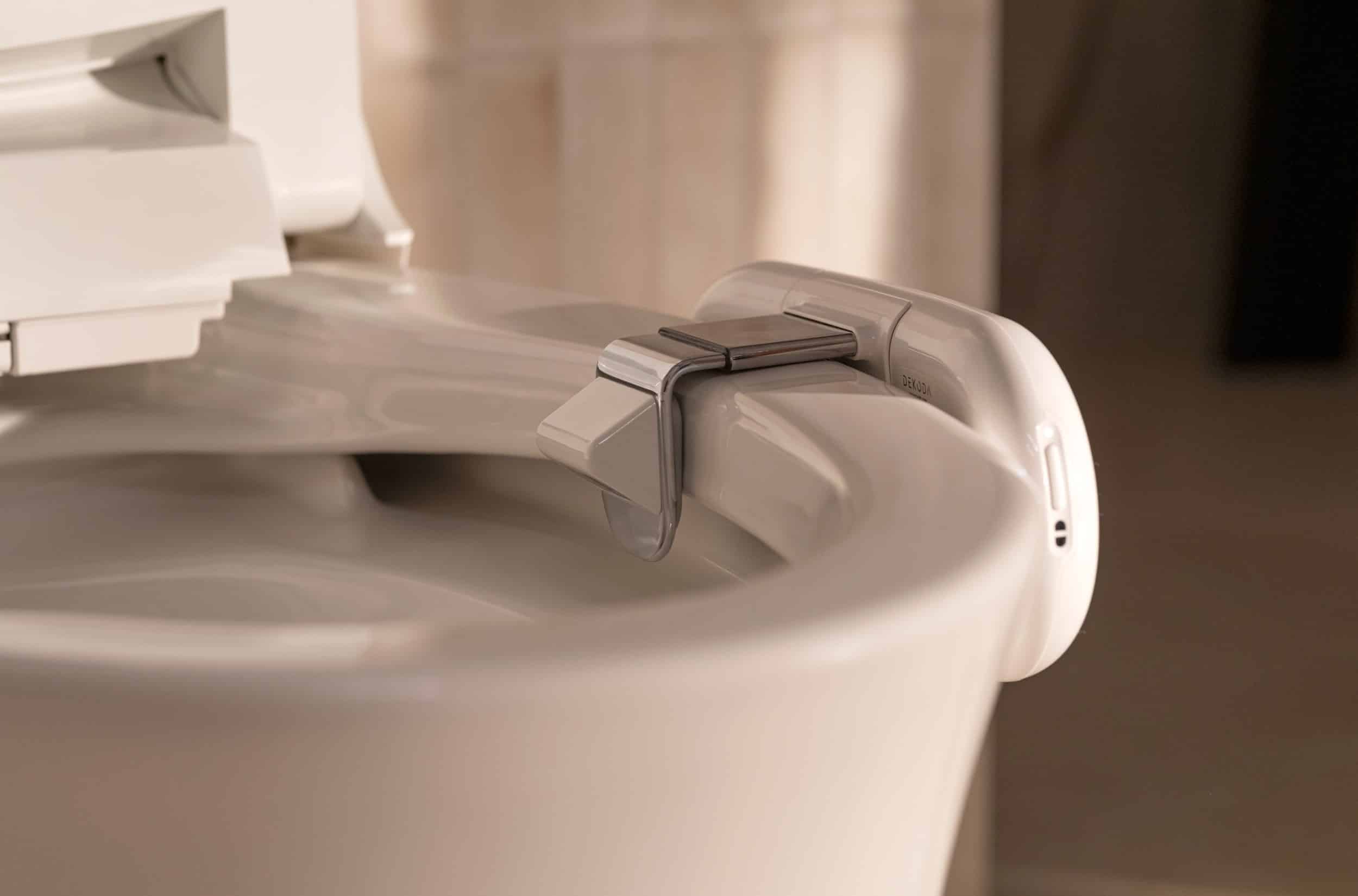 Dekoda System smart toilet diagram showing sensors, bidet wash, water-saving, app control