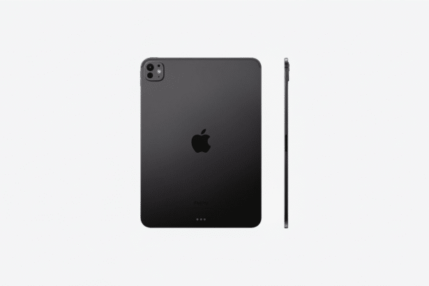 Dark gray iPad Pro, seen from the back and side, on a minimalist light gray background.