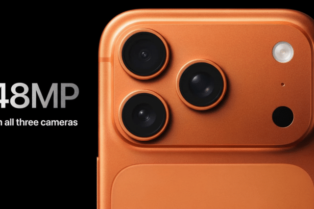 Close -up of an orange smartphone' s triple camera system with a flash , against a black background. White text on the left states 48MP On all three cameras.