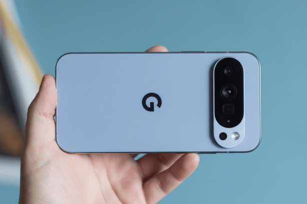 A hand holding a light blue Google Pixel phone horizontally , showcasing its camera bar and the Google logo.