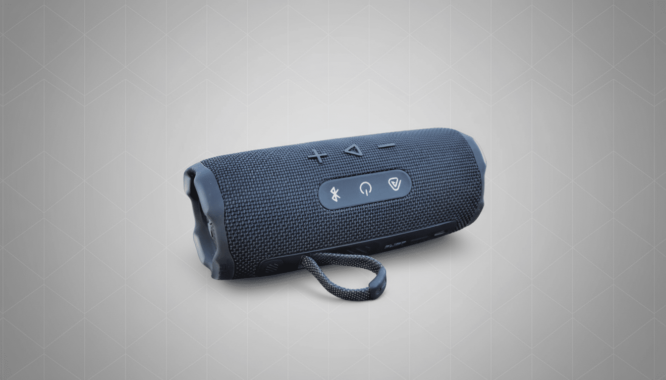 A black JBL Flip 5 portable Bluetooth speaker on a grey background with a subtle geometric pattern.