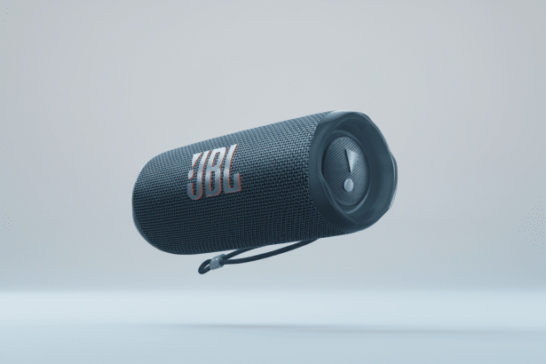 A JBL Flip 6 portable Bluetooth speaker in dark blue, with its logo and an exclamation mark symbol visible, set against a soft, light gray gradient ba
