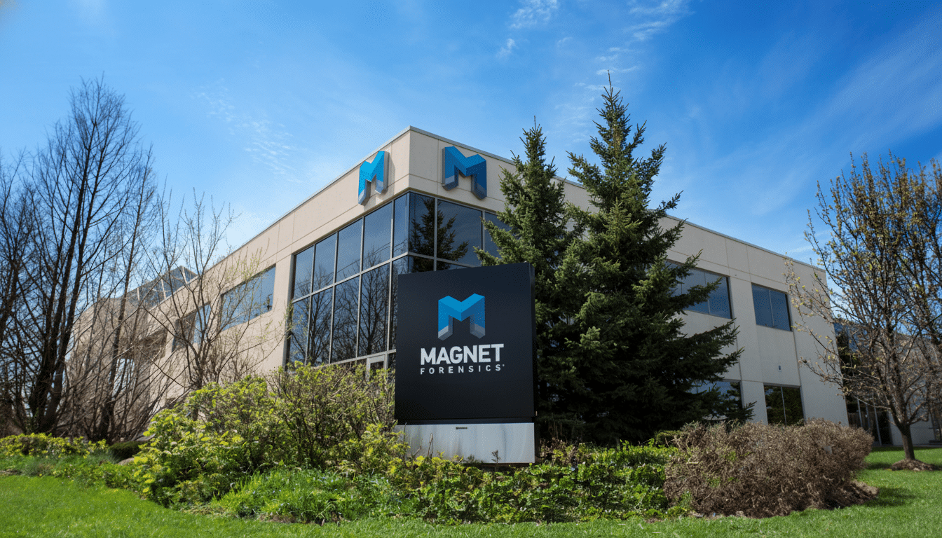 The Magnet Forensics building under a clear blue sky , with a sign displaying the company logo in the foreground.
