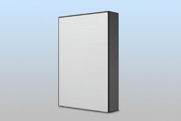 A professional , enhanced image of a Seagate external hard drive, presented in a 1 6:9 aspect ratio with a clean , flat design background featuring soft blue and gray gradients and subtle geometric patterns. The hard drive is light gray with a textured finish and a black casing, featuring the Seagate logo in the top right corner .