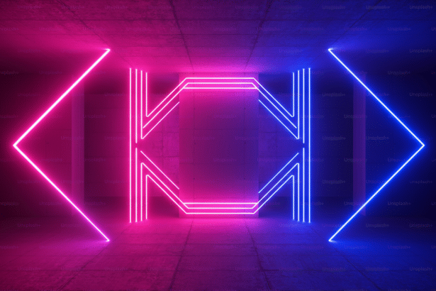 Neon lights in shades of pink and blue form geometric shapes against a dark , textured background .