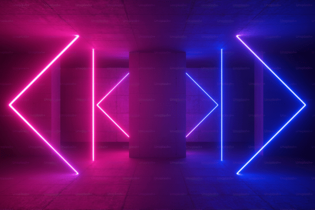 An abstract image featuring pink and blue neon lights forming geometric shapes against a dark, textured background.