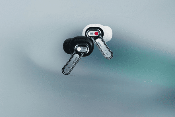 Two Nothing Ear ( 1) earbuds, one black and one white, on a soft gradient background. Filename : nothingear 1ear budsprofessional .png