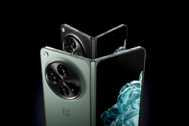 Two OnePlus Open foldable phones, one green and one black, displayed partially folded against a dark background , highlighting their camera modules and screens.