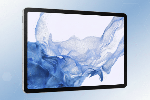 A silver tablet with a screen displaying blue flowing particles, presented at an angle on a light blue background with subtle hexagonal patterns.