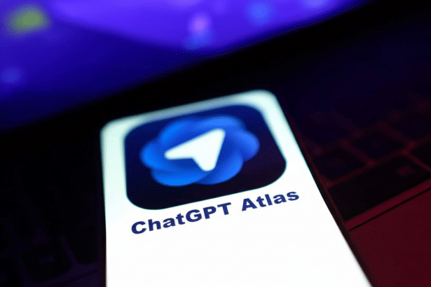 The ChatGPT Atlas app icon displayed on a smartphone screen , with a dark blue background and a white paper plane logo , resized to a 1 6:9 aspect ratio. Filename : chatgpt atlasapp icon1 69. png