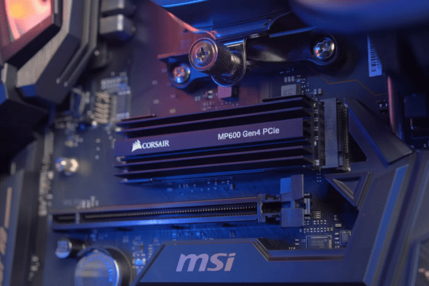 A Corsair MP600 Gen4 PCIe SSD installed on an MSI motherboard, illuminated with blue and red lighting, in a professional 16: 9 aspect ratio.