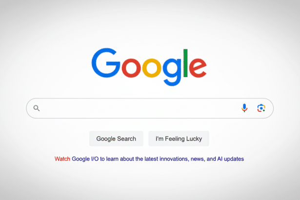 The Google search homepage with its colorful logo, search bar, and Google Search and Im Feeling Lucky buttons, along with text inviting users to watch