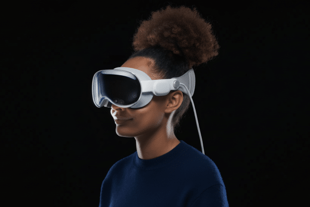 A person with dark skin and curly hair tied up , wearing a white virtual reality headset against a dark background.