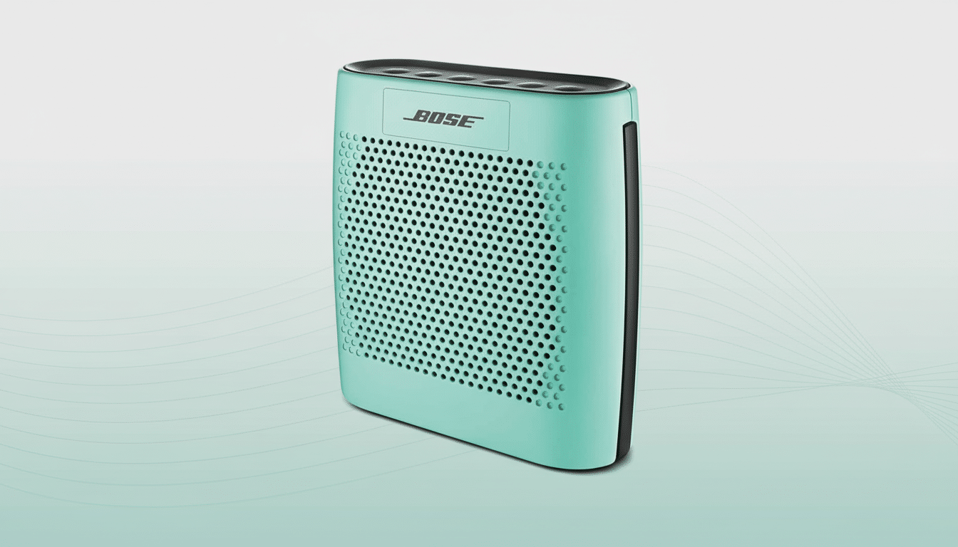 A mint green Bose speaker with a perforated front grille , set against a professional light grey background with subtle wave patterns, resized to a 1 6:9 aspect ratio. Filename : mint b osespeaker professionalbackground . png