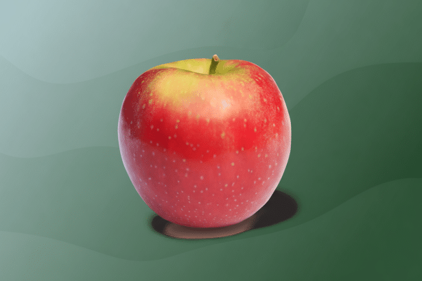 A vibrant red and green apple with a slight stem , presented against a professional flat design background with soft green wave patterns, resized to a 1 6:9 aspect ratio. Filename : professionalapple display .png
