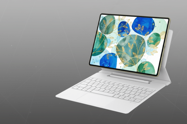 alt text: A white laptop with a gold- framed screen displaying abstract blue and green watercolor