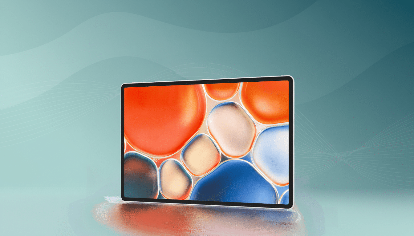 A professional shot of a white tablet displaying a colorful, abstract bubble pattern on its screen, set against a teal - to -green gradient background