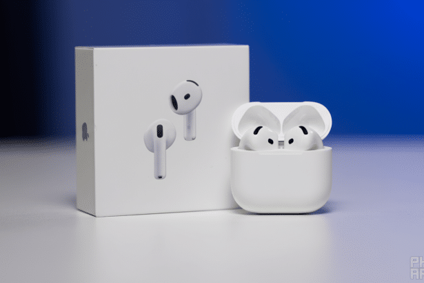 Apple AirPods Pro 2 with charging case and retail box on a table with a blue background.