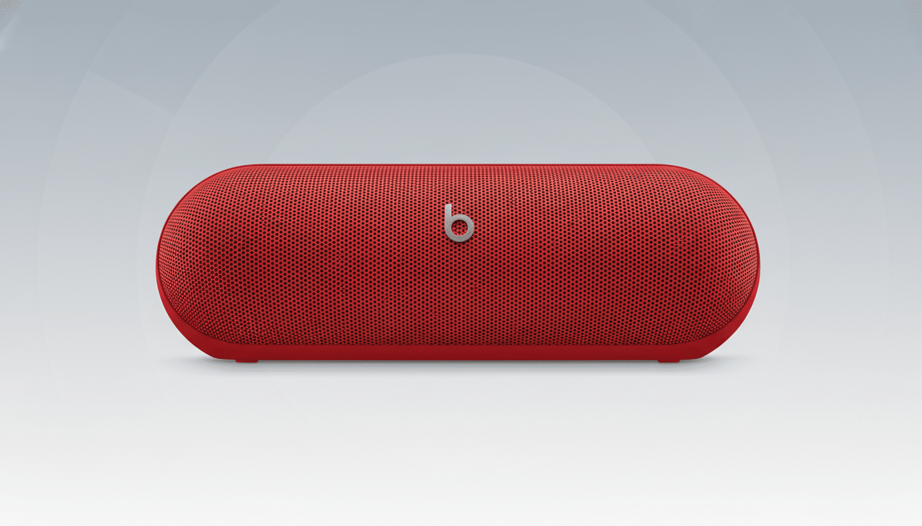 A red Beats Pill + portable Bluetooth speaker with the silver b logo centered on the front grille , set against a professional flat design background with a subtle gradient from light gray to white .