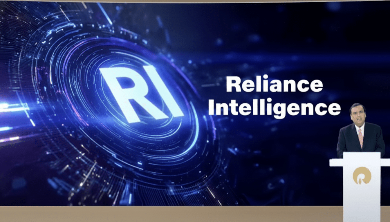 A man in a suit stands behind a podium, presenting in front of a large screen displaying RI Reliance Intelligence with a futuristic blue circular graphic .