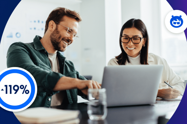 Two smiling professionals , a man and a woman, working together at a desk with a laptop and a glass of water, overlaid with a blue circle showing - 119% and a blue logo of a stylized animal in the top right .