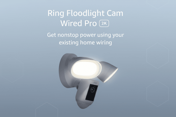 A professional image of the Ring Flood light Cam Wired Pro 2K, a white security camera with two bright flood lights, mounted on a wall . The image has a clean , soft blue - grey background with subtle hexagonal patterns and text overlay ing the top , describing the product. Filename : ringflood lightcam wiredpro 2k.png