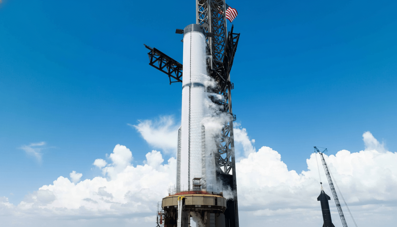 A large white rocket on a launchpad under a blue sky with white clouds, with the American flag visible at the top.