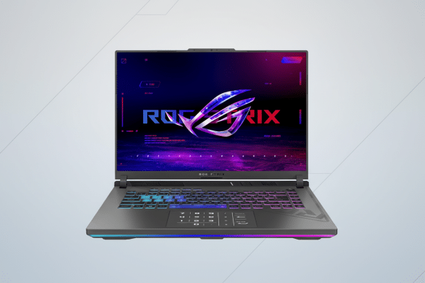 A front view of an ROG Strix laptop on a light gray background with subtle geometric patterns. The screen displays a colorful ROG St rix logo and other UI elements. The keyboard and under glow lighting are illuminated with vibrant RGB colors. Filename : rogst rixlaptop professional .png