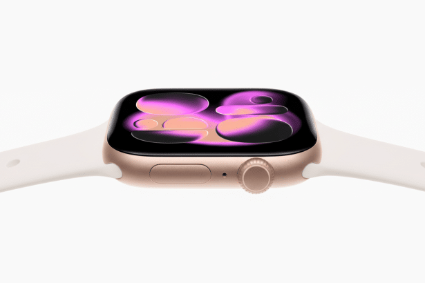 A close-up shot of a rose gold Apple Watch with a white band, displaying a colorful, abstract watch face.