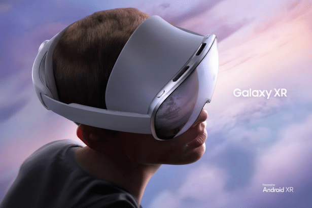 A person wearing a white and grey Samsung Galaxy XR virtual reality headset with Galaxy XR and Powered by Android XR text on a blurry purple and pink background .
