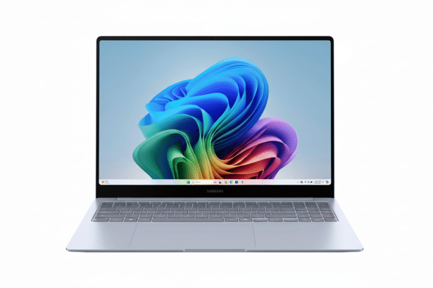 A professional front -facing view of a silver Samsung laptop with a colorful abstract wallpaper on its screen, set against a clean white background.