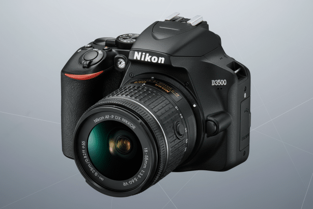 A professional shot of a black Nikon D350 0 DSLR camera with an 18 -55mm lens, set against a subtle gray gradient background with faint geometric patterns.