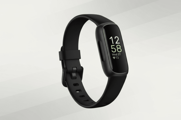 A black Fitbit Inspire 3 smartwatch with a black strap, displaying the time 12 :58, Wednesday 27, and 73 heart rate on a professional light grey background with subtle diagonal patterns. Filename : fitbit inspire3 smart watch. png