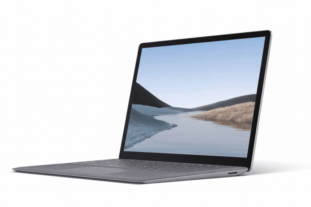 A professional shot of a silver laptop, slightly open , displaying a scenic desktop background of a river flowing through hills .