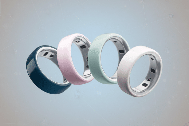 Four smart rings in different colors (navy blue, pink, mint green, and off -white) are arranged in a diagonal line on a soft blue- grey background wit