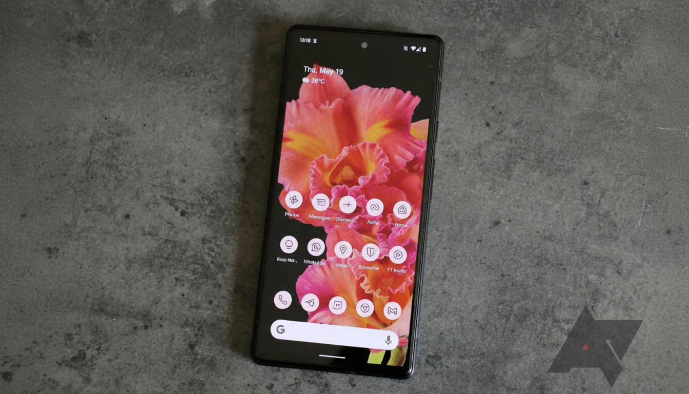 The resized image shows a dark -colored smartphone displaying a vibrant pink and orange floral wallp
