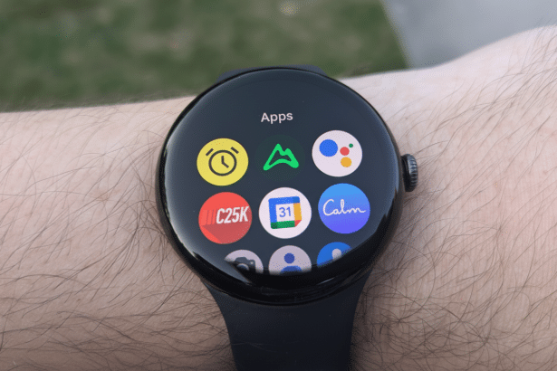 A close -up shot of a smartwatch displaying various app icons on its screen, worn on a person s wrist.