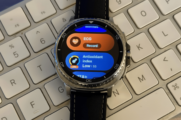 A smartwatch displaying health metrics, including ECG and antioxidant index, resting on a white keyboard .