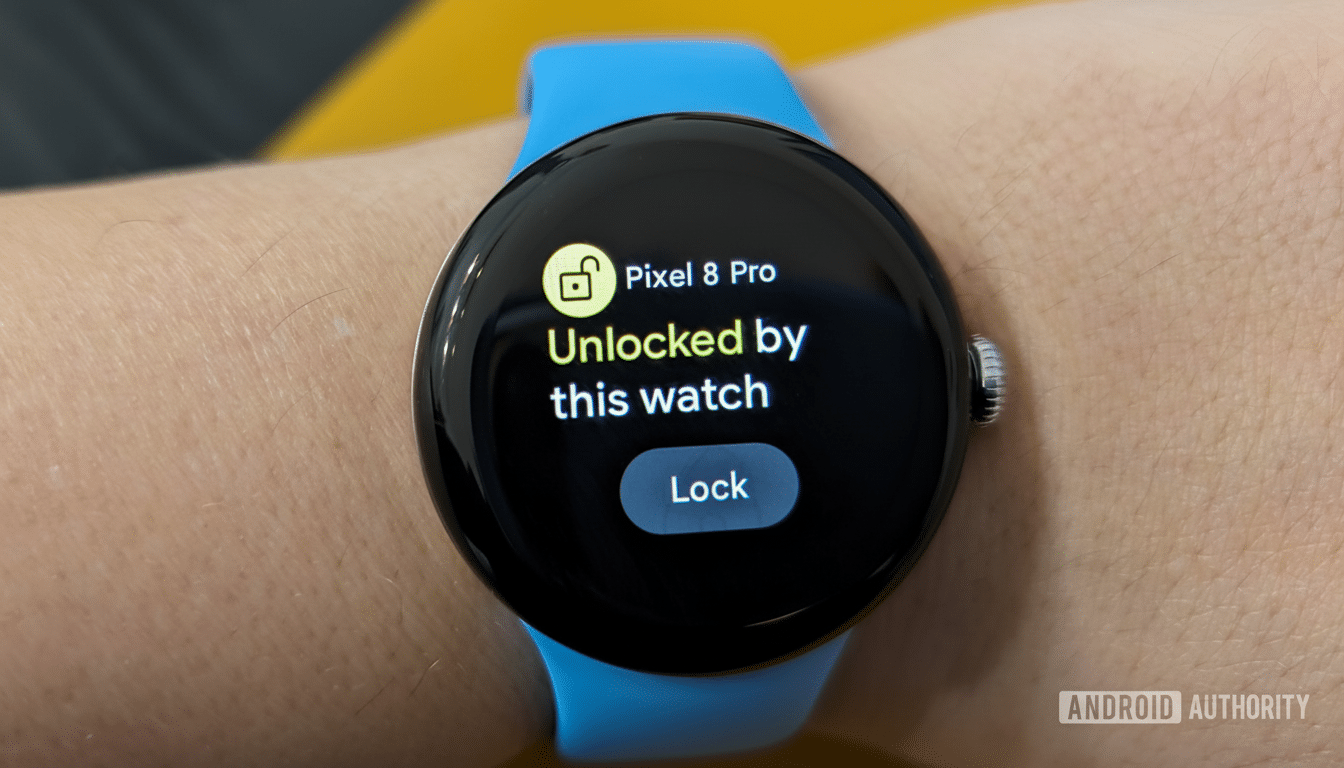 A close -up of a smartwatch on a wrist, displaying Pixel 8 Pro Un locked by this watch with a lock icon.