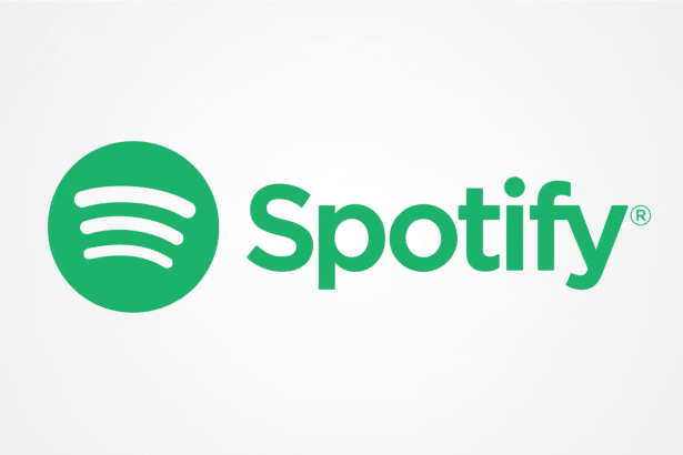 The Spotify logo, featuring a green circle with three white curved lines resembling sound waves to the left, and the word Spotify in green text with a