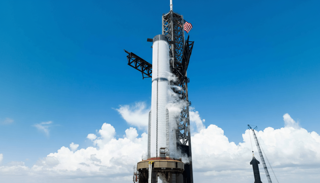 A large white rocket stands tall on a launchpad under a blue sky with white clouds, with the American flag visible near its top .