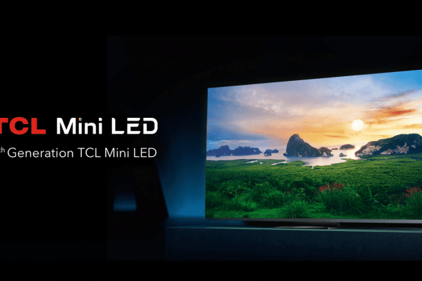 A TCL Mini LED television displaying a scenic landscape with a sunset over water and islands.