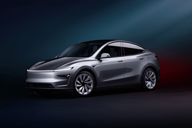 A sleek , silver electric car with modern design features, including a continuous front light bar, parked on a dark , gradient background. Filename : silverelectric car1 69. png