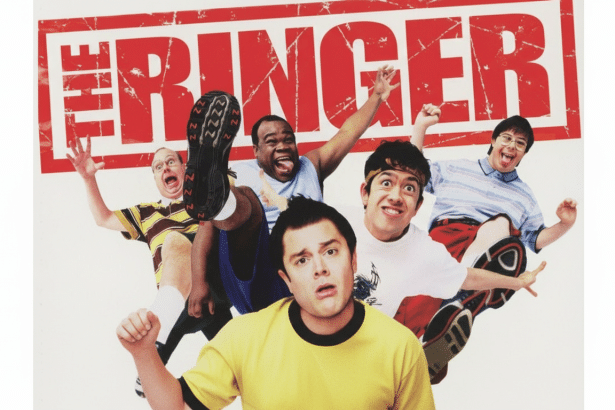 A promotional image for the movie The Ringer featuring five men making expressive and comedic faces, with the film 's title in red block letters at the top.