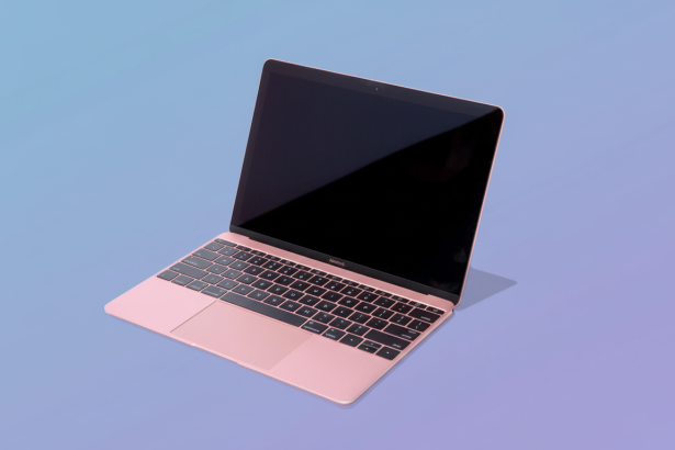 A rose gold MacBook with a black screen and keyboard, presented on a soft gradient background transitioning from light blue to lavender.