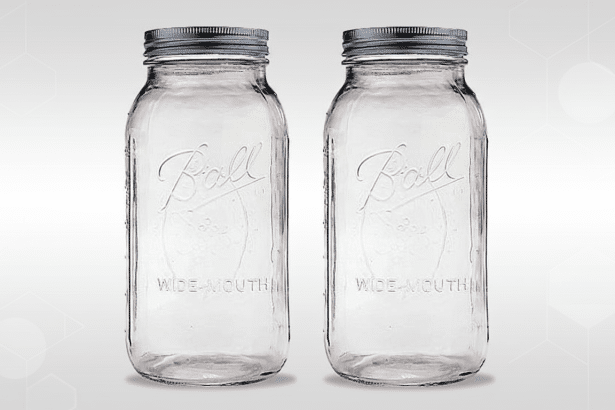 The Ball Wide-Mouth jars are made of clear glass with a professional flat design background showcasi
