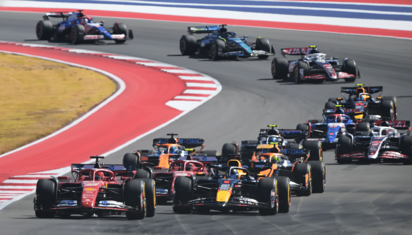 A professional shot of multiple Formula 1 cars racing on a track , resized to a 1 6:9 aspect ratio.